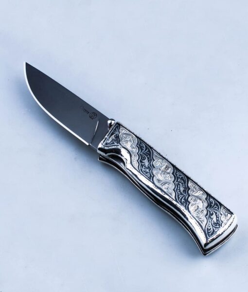 складной серебряный нож